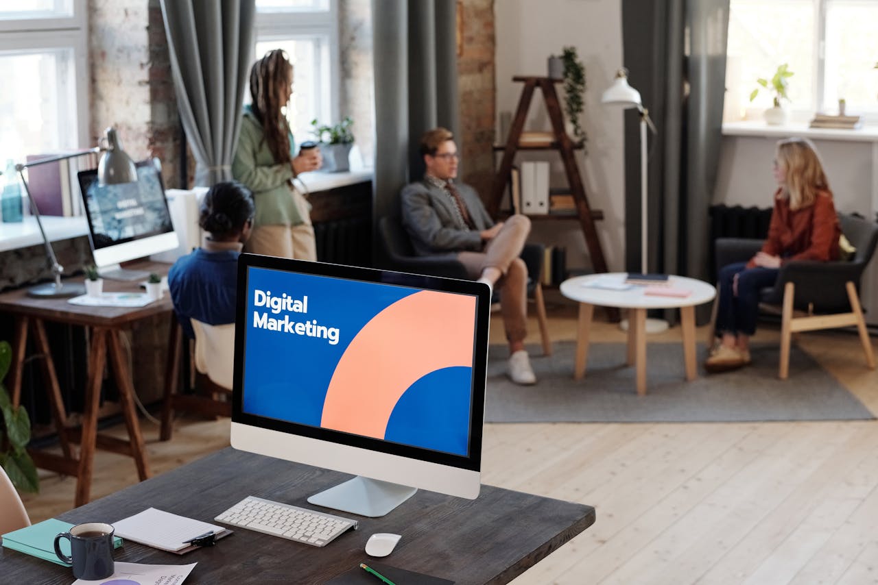 home-hero-bg Collaborative team meeting in a modern office setting with digital marketing focus.