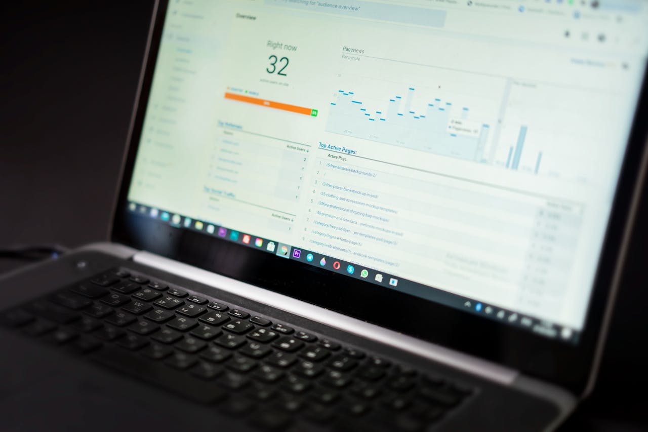 about-01 A laptop displaying an analytics dashboard with real-time data tracking and analysis tools.